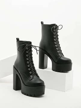 A pair of Minimalist Lace-up Front Platform Chunky Heeled Boots on a white background.